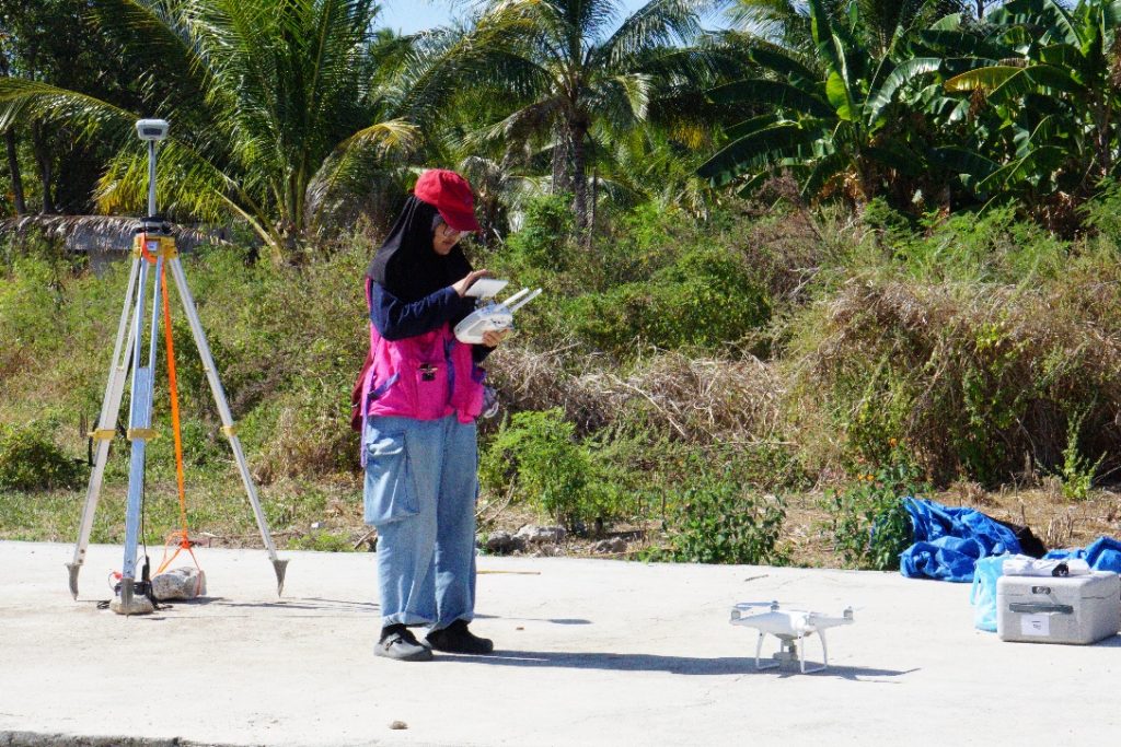 A person standing next to a drone
AI-generated content may be incorrect.